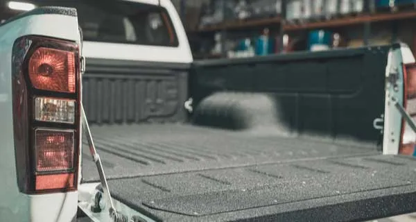 Truck bed with a fresh spray-in bed liner