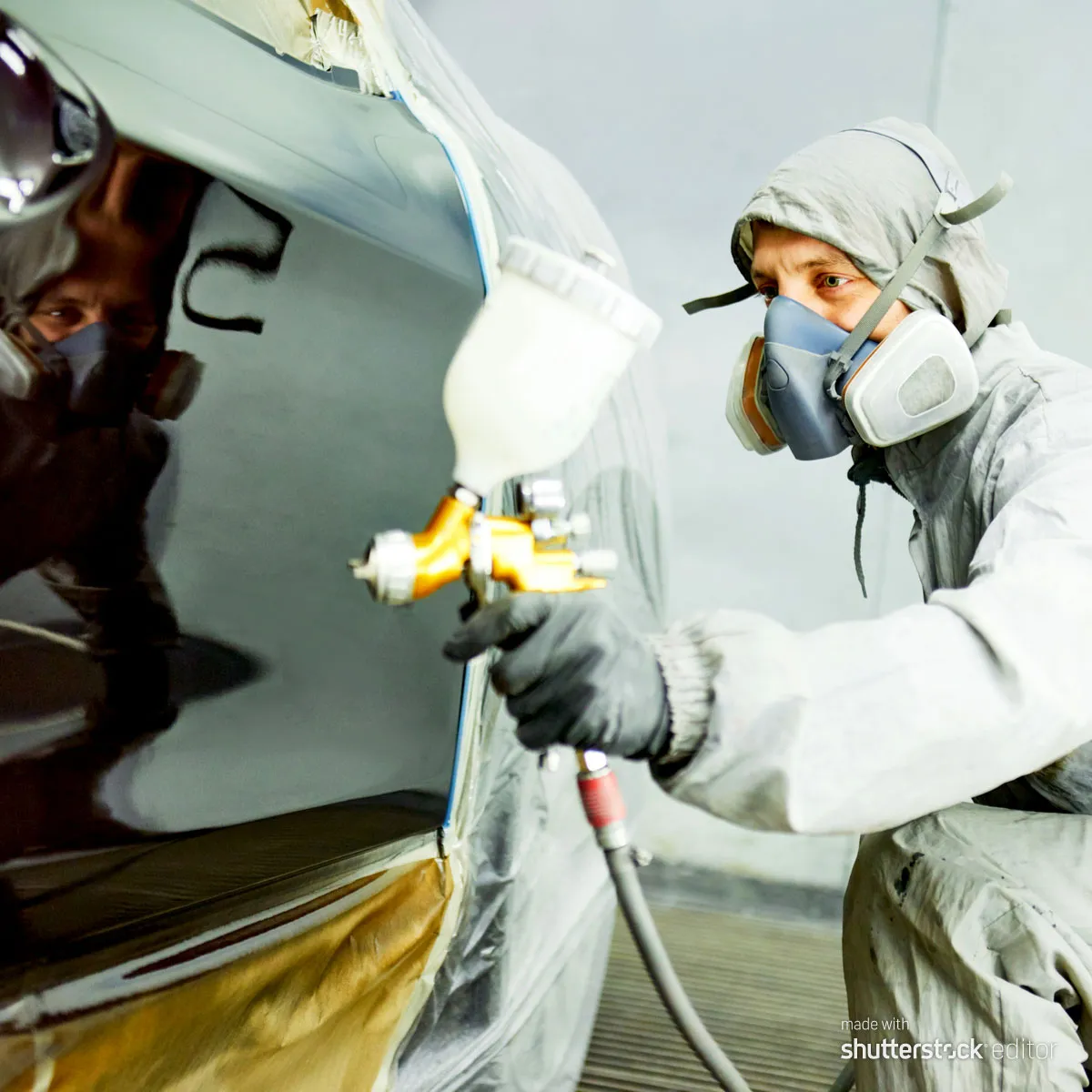 RX Collision technician restoring a damaged vehicle